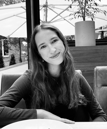 Portrait of Anastasiia Kryvenko seated and smiling